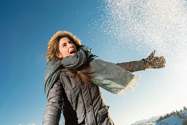 istock Happy  woman posing against high snowy mountains 539043079