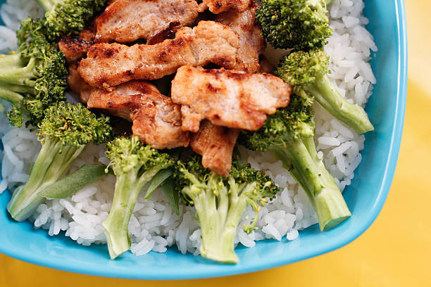 istock Blue bowl filled with fresh rice and vegetable 539055063