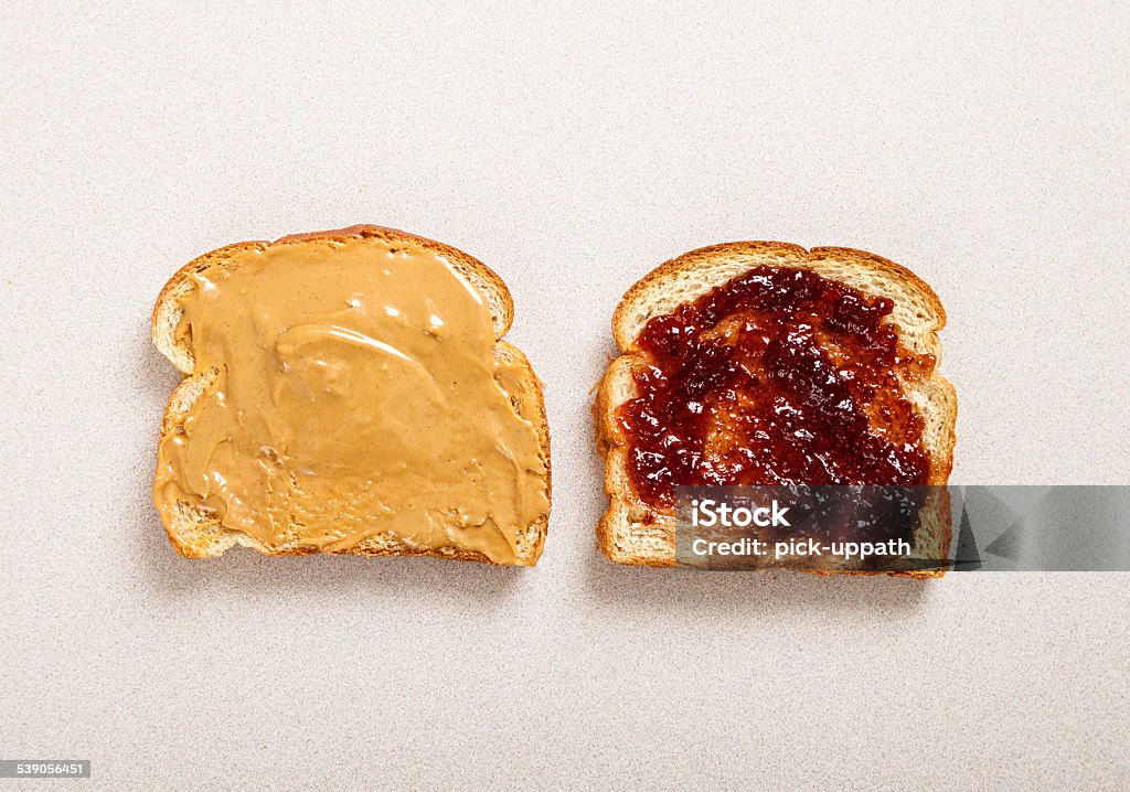 Peanut butter jelly sandwitch Two halves of bread and with peanut butter and jelly 2015 Stock Photo