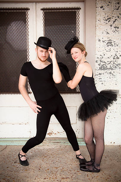 istock Pair of jazz ballet dancers wearing costume pose for camera. 539057315