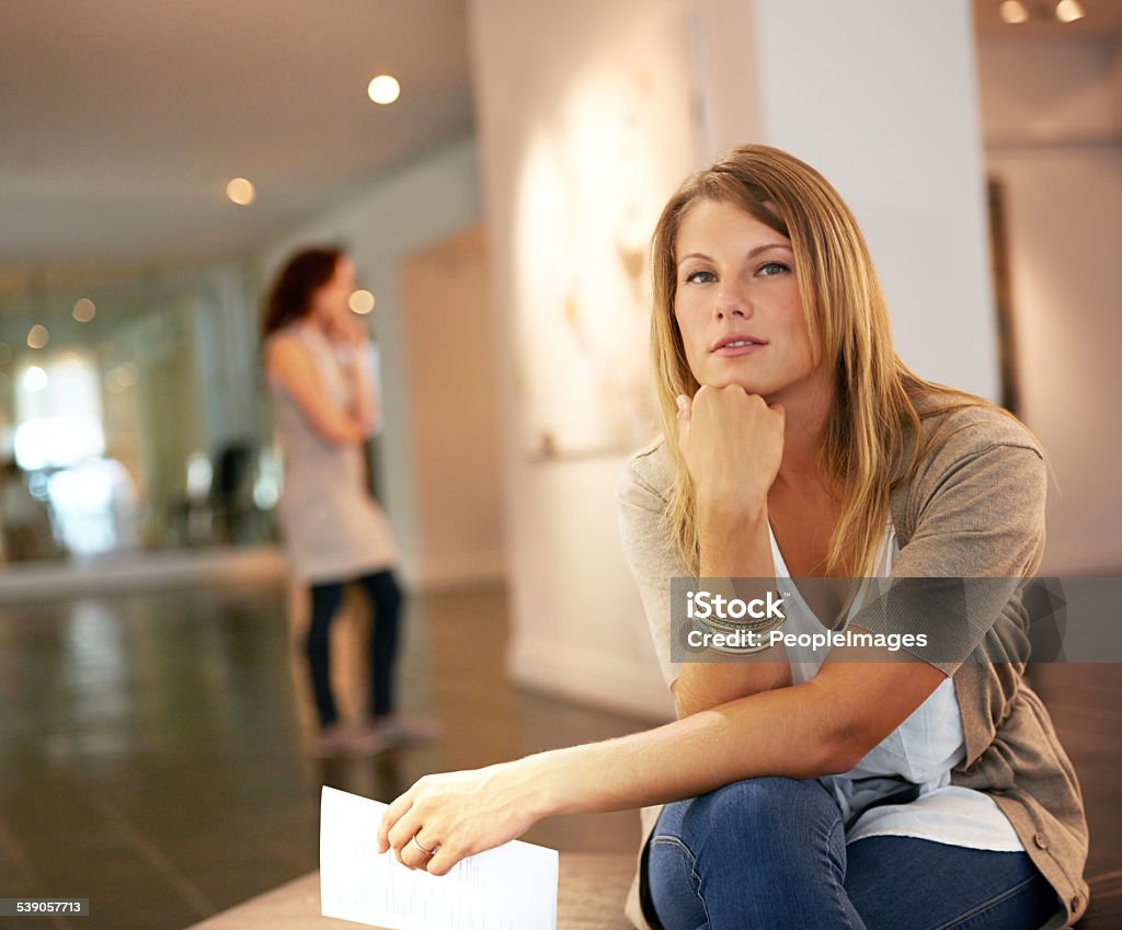 Contemplating centuries of art Shot of a thoughtful-looking young woman enjoying a day at a galleryhttp://195.154.178.81/DATA/istock_collage/0/shoots/781126.jpg Art Dealer Stock Photo