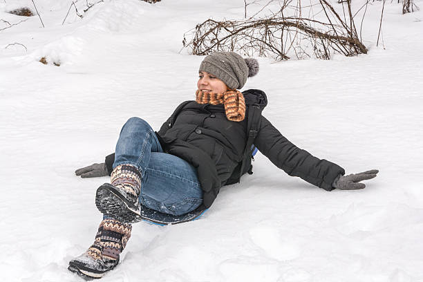 istock Girl lying on the snow 539069775