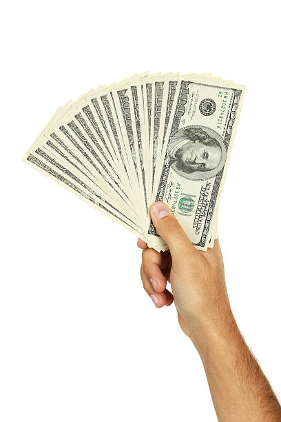 istock Men hand holding hundred dollar bill on white background 539070255