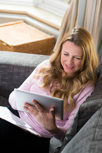 istock mature woman online 539072107