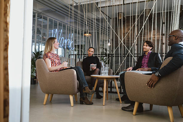istock Office workers having a meeting in lobby 539080611
