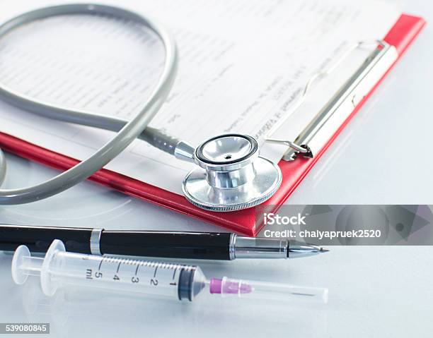 Medical History On Clipboard With Stethoscope On Light Background Stock Photo - Download Image Now