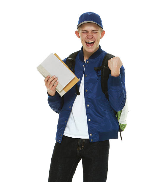 istock Male student holding books and cheering 539084378