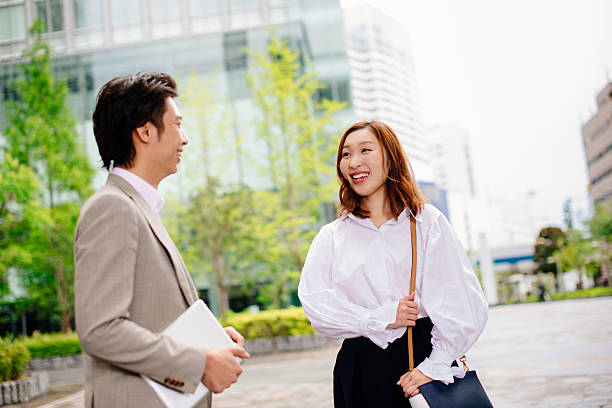 istock Two young people in modern downtown district in Tokyo 539084908