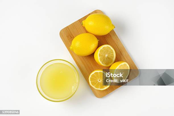 Lemon Juice And Fresh Lemons Stock Photo - Download Image Now - Lemon Juice, Bowl, Freshness