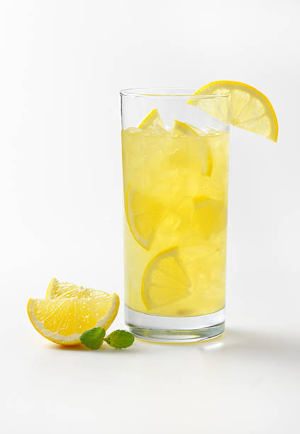 fresh lemon juice glass of fresh lemon juice with ice lemonade stock pictures, royalty-free photos & images