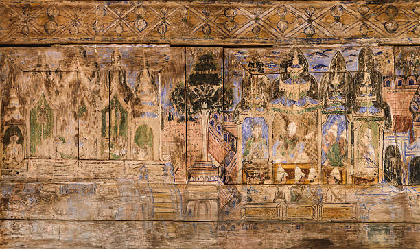 istock Ancient Thai mural painting on wooden temple wall 539085838