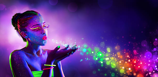 Neon Model Blowing Spectrum Lights Disco Paint Makeup With Uv Lights body paint stock pictures, royalty-free photos & images