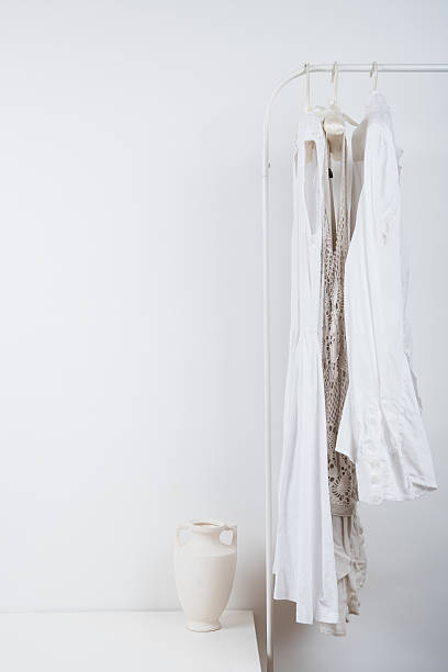 istock bedroom white interior, clothes on the hanger 539087968