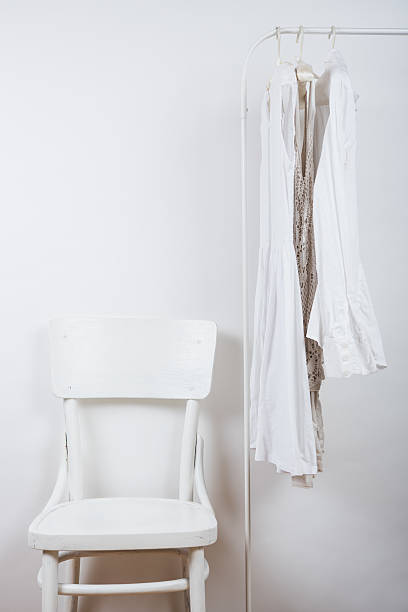 istock bedroom white interior, clothes on the hanger 539088082