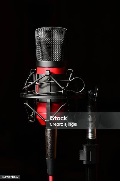 Recording Studio Red Microphone With Shock Mount Stock Photo - Download Image Now - Black Background, Microphone, Stay Tuned