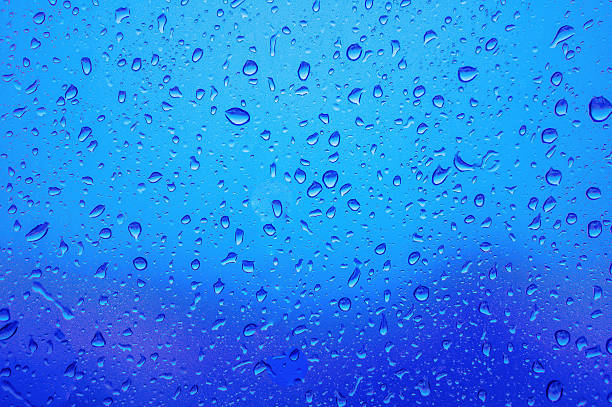 istock Blurred abstract background view of Rain drops on window surface 539091394