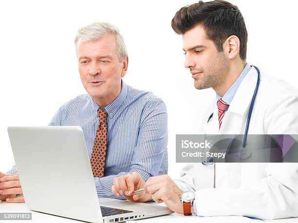 Male Doctor And His Patient Stock Photo - Download Image Now - 2015, Adult, Analyzing