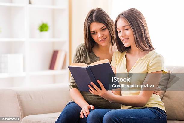 Mother And Daughter Stock Photo - Download Image Now - Book, Teenager, Reading