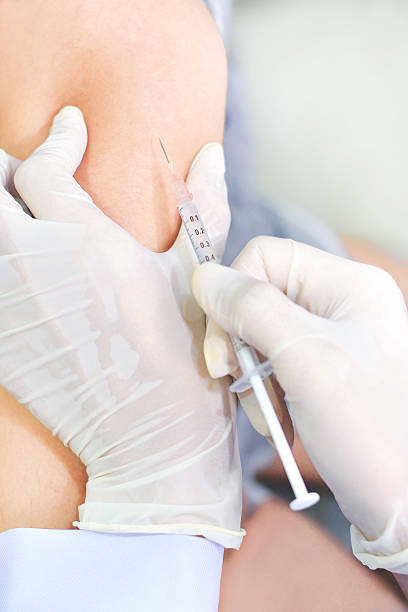 istock Doctor doing an injection to his patient 539093000