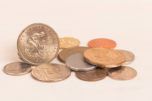 istock Pile of US coins isolated on white background 539093051