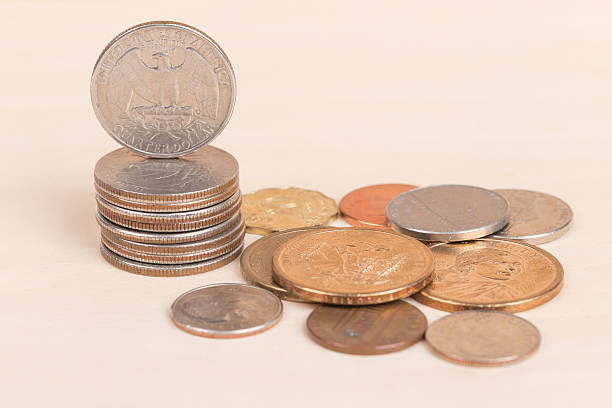 istock Pile of US coins isolated on white background 539093119