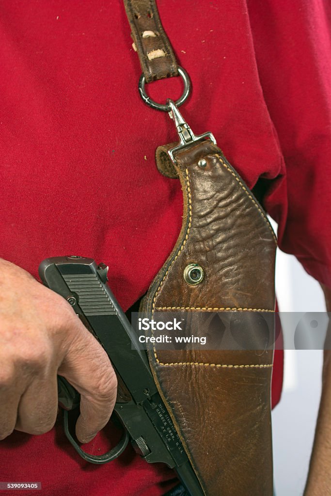 Semi-Automatic Pistol and Firearm Shoulder Holster on Man 2015 Stock Photo