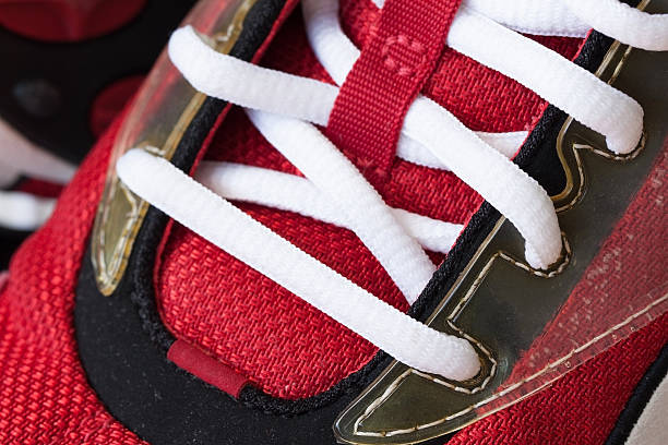istock Youth red sneaker with white untied the laces 539093826