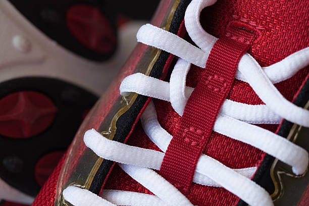 istock Close-up of a red sneaker with white shoelaces 539093884
