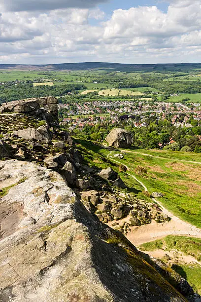 Ilkley town overlooked from Ilkley Moor (Cow and Calf Rocks). Near Leeds, Yorkshire, England