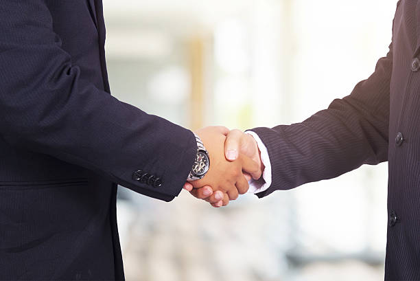 istock Business handshake. Two businessman shaking hands with each othe 539094946