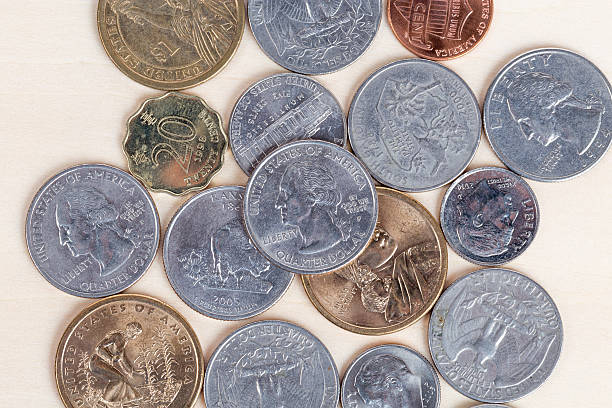 istock Pile of US coins isolated on white background 539094989