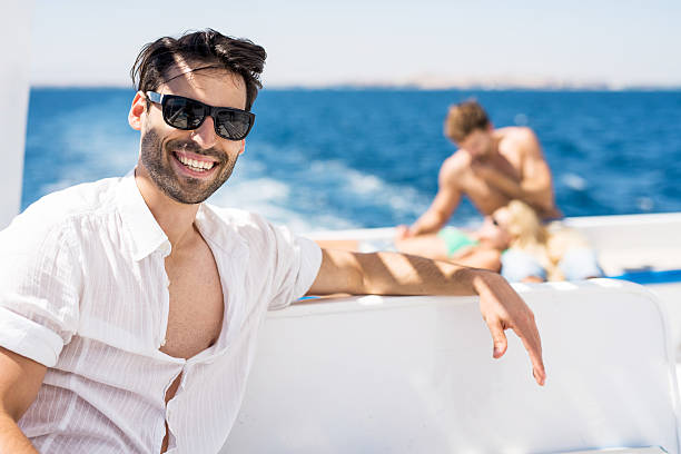 istock Happy young man traveling on boat. 539095293