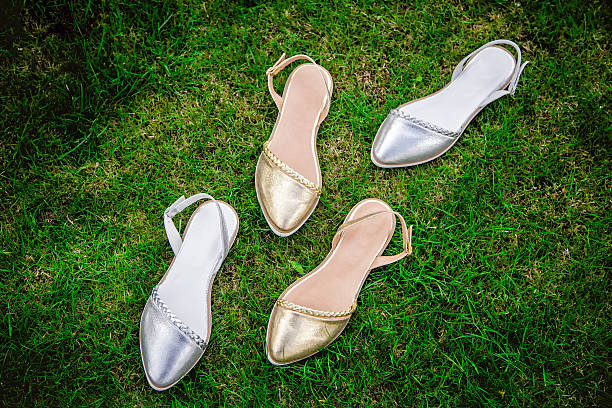 istock serebryan?e zolot?e and sandals on a green grass, advertising 539099972
