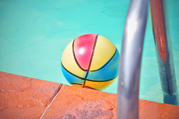 istock Inflatable colorful ball floating in the swimming pool 539101088