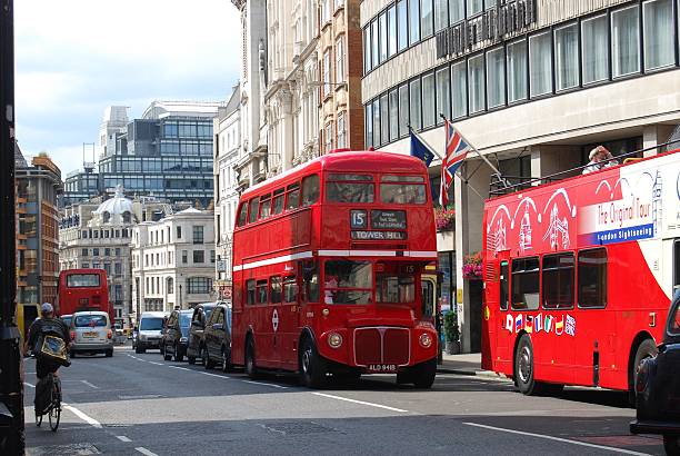 London, UK - July 28, 2010: Red double decker buses on a busy London Street