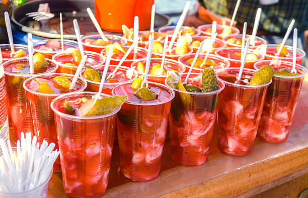 Pickle Sour turnip juice, with pickled cabbage and cucumbers, as sold by the Galata Bridge in Istanbul. pickled turnip stock pictures, royalty-free photos & images