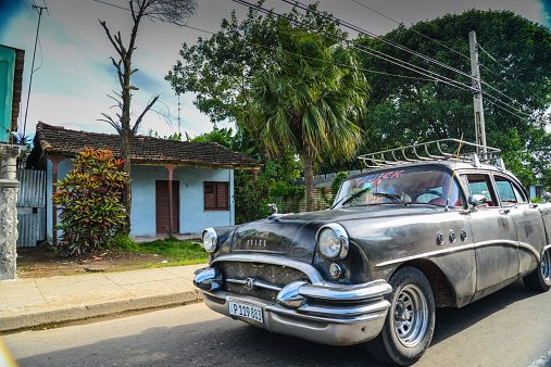 Havana, Cuba - December 14, 2014: Classic American car drive on street in Havana,Cuba.Cuba is known for the beauty of its vintage cars