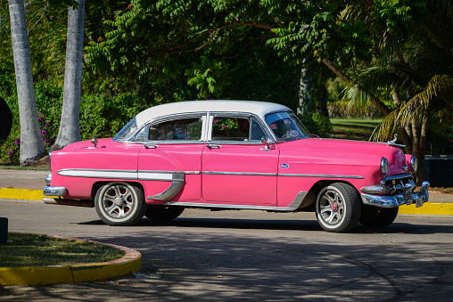 Havana, Cuba - December 15, 2014: Classic American car drive on street in Havana,Cuba.Cuba is known for the beauty of its vintage cars