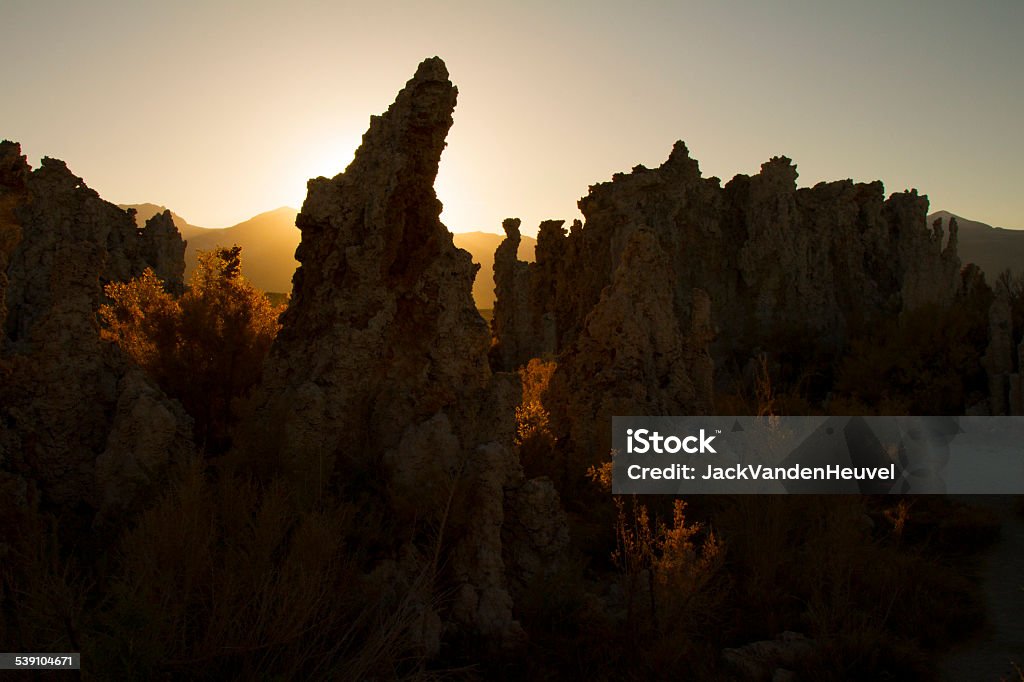 Mono Lake in Autmn The strange formations at Mono Lake are so unique.  Here I chose to take  photo with the setting sun in autumn, shooting toward the sun. 2015 Stock Photo