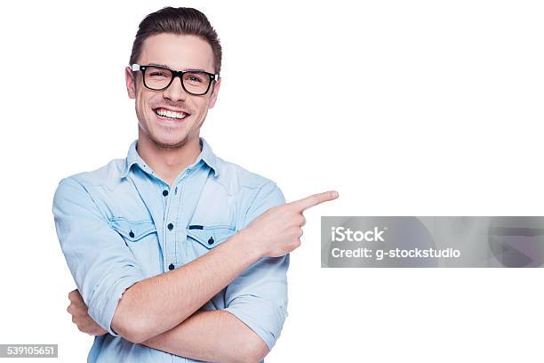 Cheerful Young Man Pointing Copy Space Stock Photo - Download Image Now - Pointing, Men, People