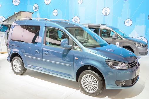 Brussels, Belgium - January 15, 2015: Volkswagen Caddy Combi MPV car on display during the 2015 Brussels motor show. People in the background are looking at the cars.