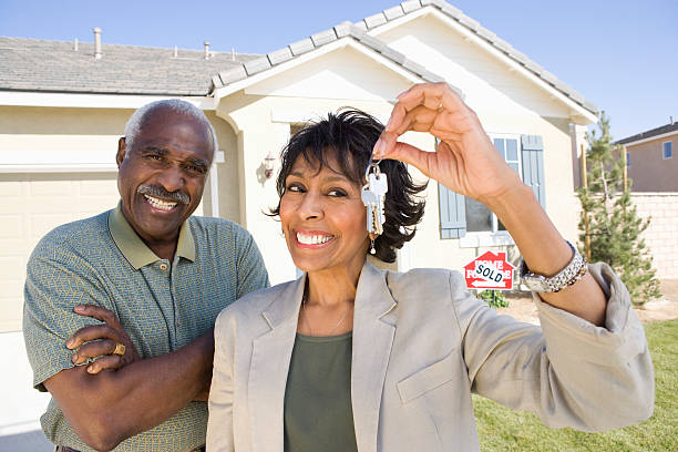 istock Mid-adult couple with new home 539106749