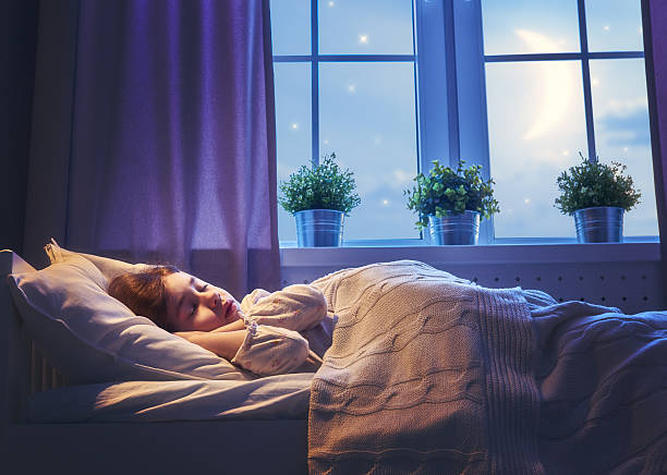 girl sleeping in the bed Adorable little child girl sleeping in the bed. Quiet sleep quiet starry night. tranquil evening stock pictures, royalty-free photos & images