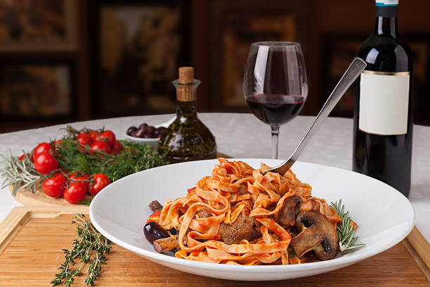 Tagliatelle with steak and mushrooms plate of Italian pasta italian food stock pictures, royalty-free photos & images