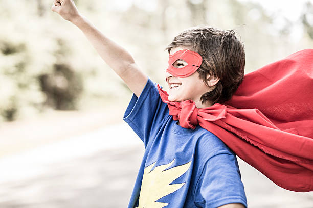 istock Little boy playing superhero outdoors. Pretend, dress up. 539111690