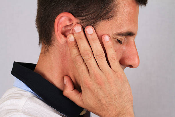 istock Man with a headache. Man with ear pain, Earache. 539114572