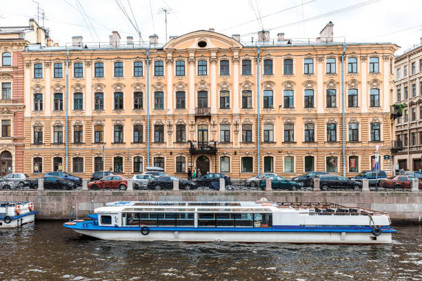 Boats on Fontanka river St.Petersburg, Russia - May 18, 2016: passenger boats floating by Fontanka River. mikhail lomonosov stock pictures, royalty-free photos & images