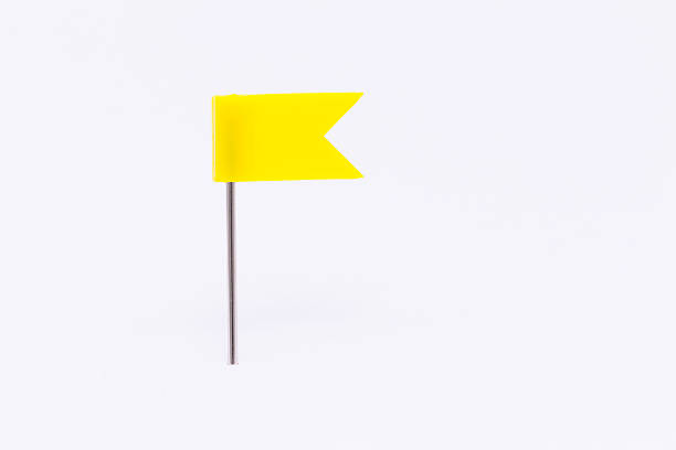 istock Yellow flag pin isolated white background 539115098