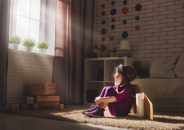 istock girl plays astronaut 539116356