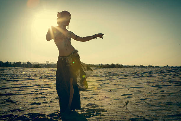 istock Beautiful girl dancing ethnic dances in desert 539117314